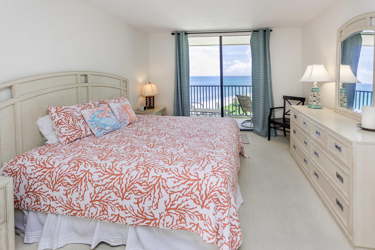 400 Ocean Trail Way, Unit 904 Jupiter, FL 33477 - Photo 15 of 31 a bedroom with a large bed and a window