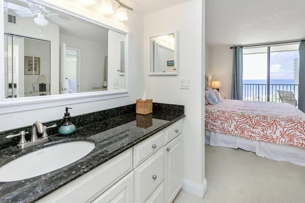 a en suite bathroom with double sink and a mirror