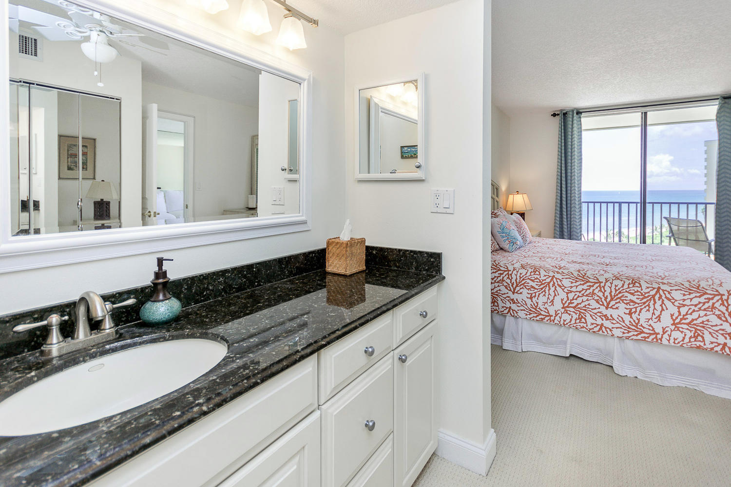 400 Ocean Trail Way, Unit 904 Jupiter, FL 33477 - Photo 16 of 31 a en suite bathroom with double sink and a mirror