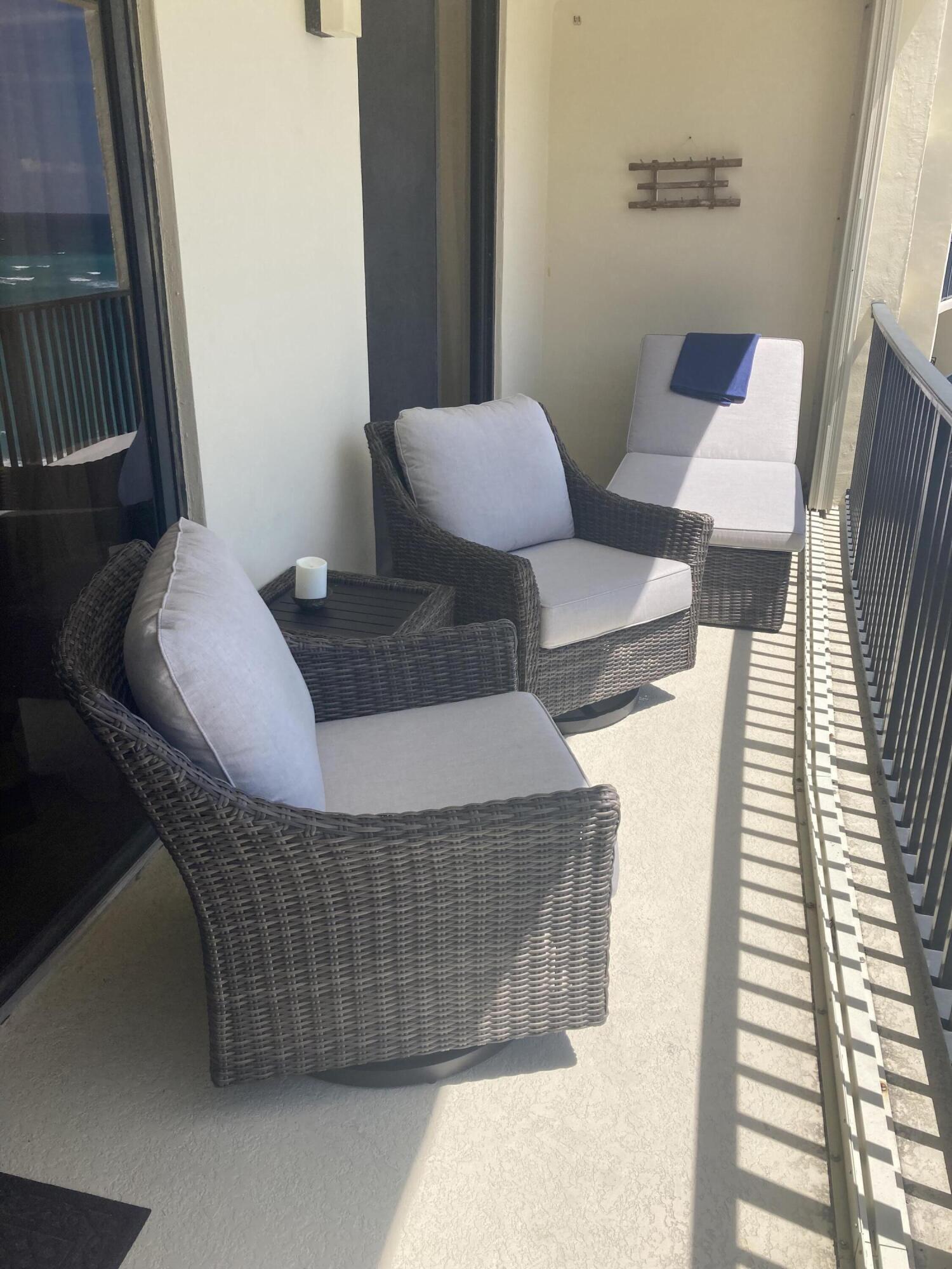 400 Ocean Trail Way, Unit 904 Jupiter, FL 33477 - Photo 5 of 31 a living room with furniture and wooden floor