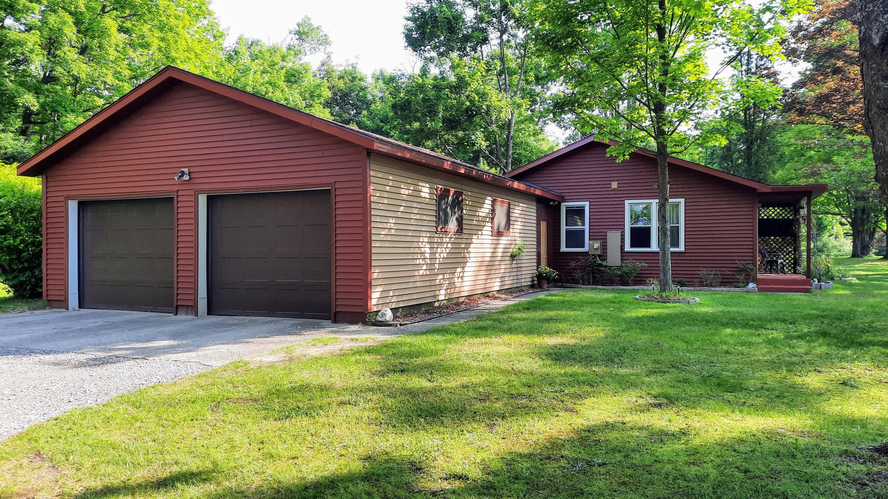 8424 3rd Street Onekama, MI 49675 - Photo 10 of 77 2-Car Attached Garage