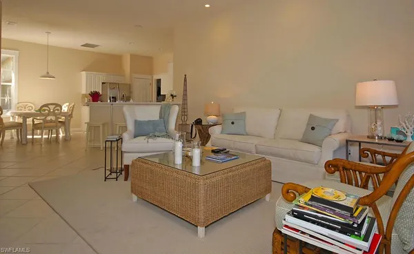 a living room with furniture and a table