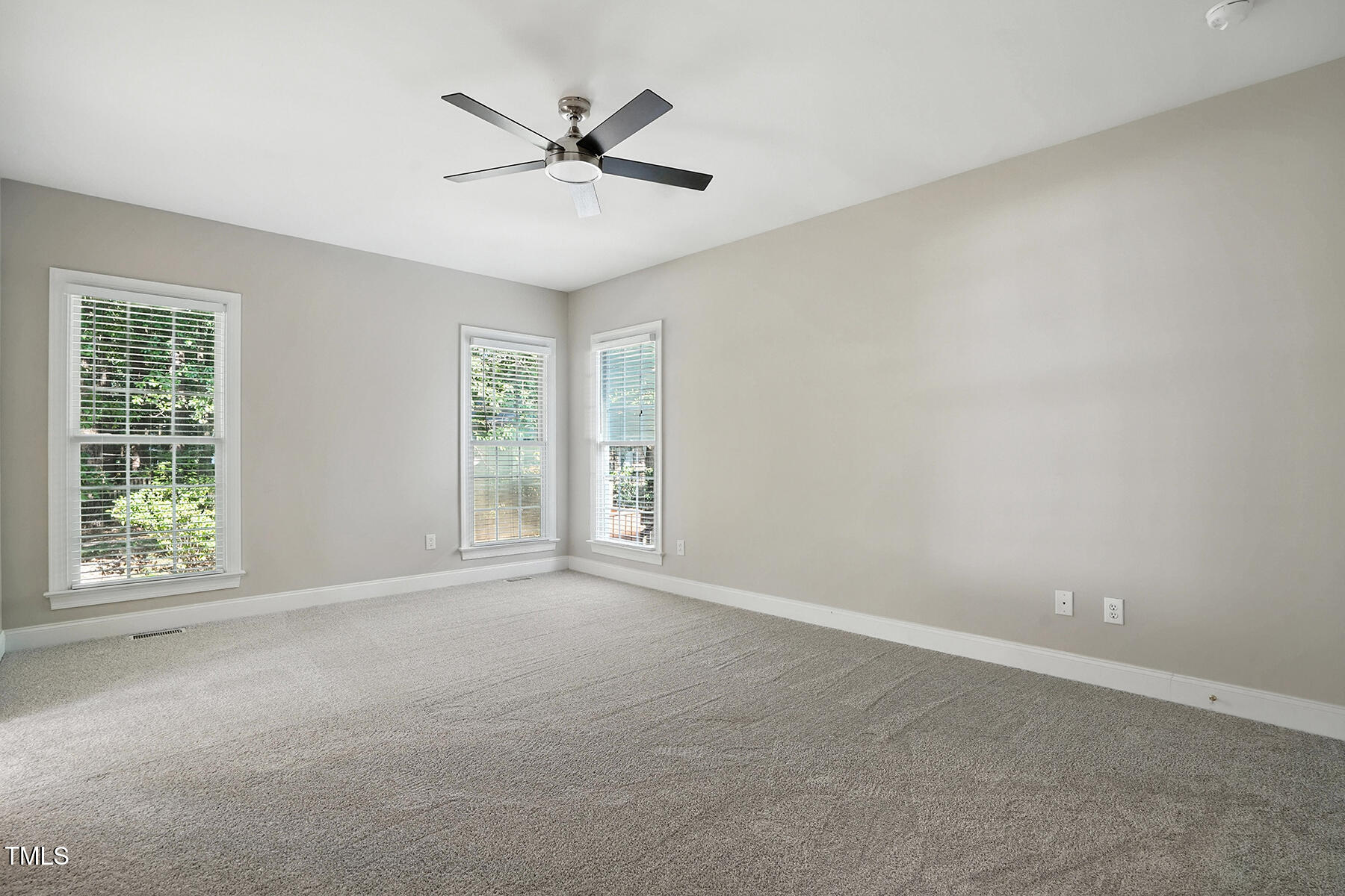 104 Vatersay Drive Apex, NC 27502 - Photo 19 of 30 a view of an empty room with a window