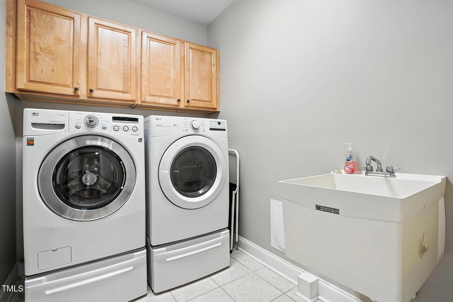 104 Vatersay Drive Apex, NC 27502 - Photo 23 of 30 a utility room with dryer and washer