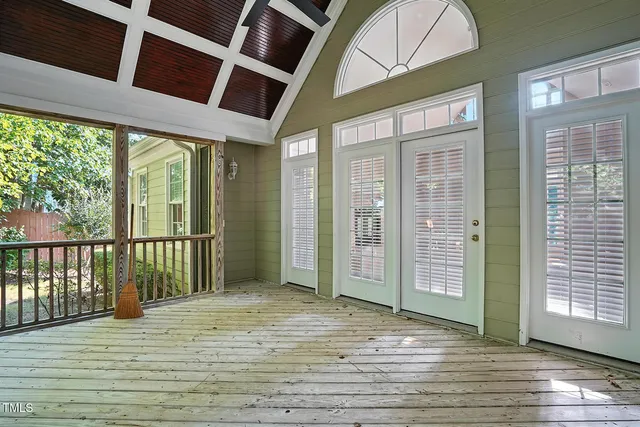 a view of a house with a door and wooden floor