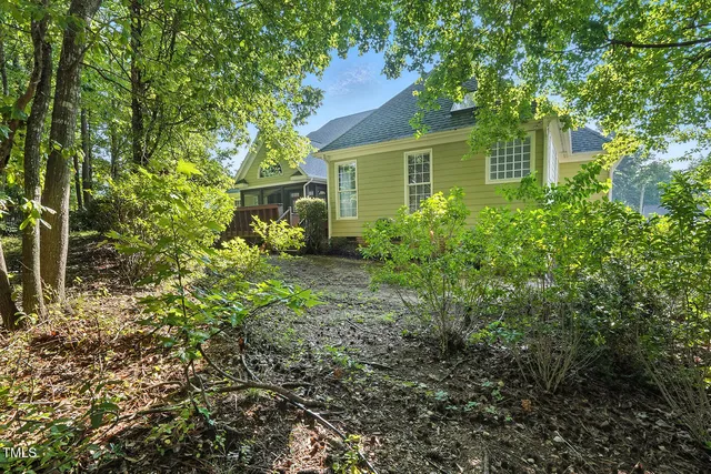 a backyard of a house with lots of green space