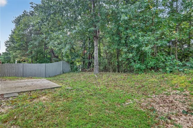 a backyard of a house with lots of green space