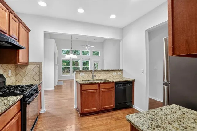 a kitchen with a stove and a sink