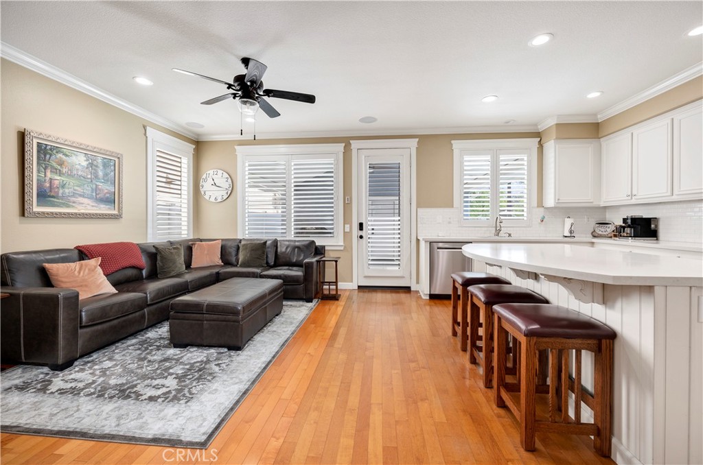 40152 Stowe Road Temecula, CA 92591 - Photo 12 of 56 a living room with furniture and a wooden floor
