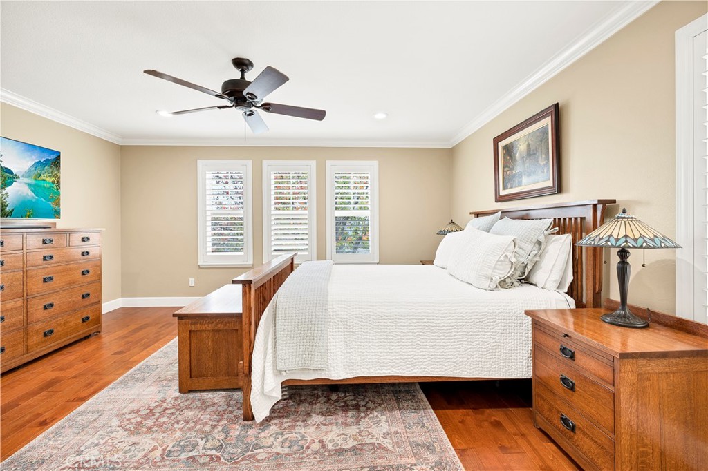 40152 Stowe Road Temecula, CA 92591 - Photo 26 of 56 a bedroom with a bed and wooden floor