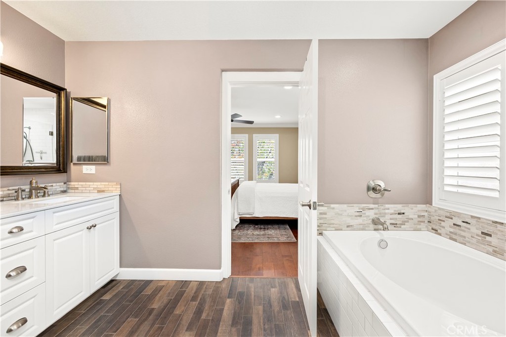 40152 Stowe Road Temecula, CA 92591 - Photo 27 of 56 a bathroom with a tub sink and mirror