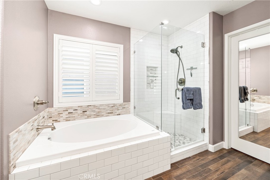 40152 Stowe Road Temecula, CA 92591 - Photo 29 of 56 a bathroom with a bathtub and a shower