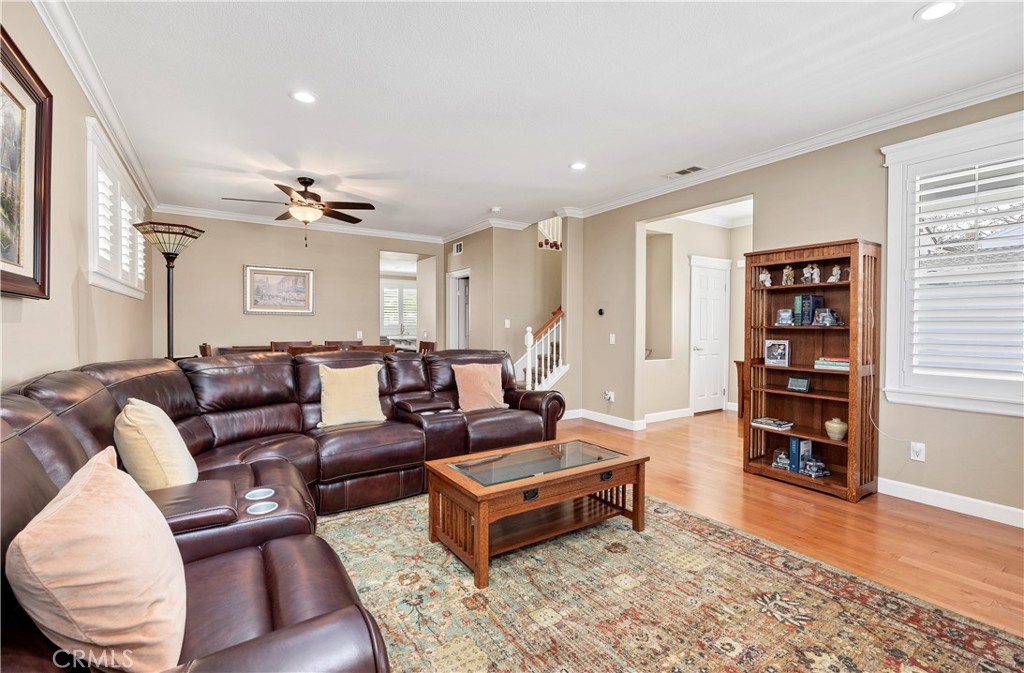 40152 Stowe Road Temecula, CA 92591 - Photo 7 of 56 a living room with furniture and wooden floor