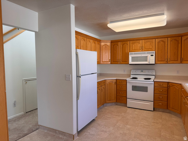 461 Topaz Boulevard, Unit 6 Delta, UT 84624 - Photo 12 of 45 Kitchen & view of hallway