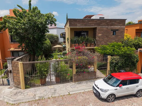 a car parked in front of a house