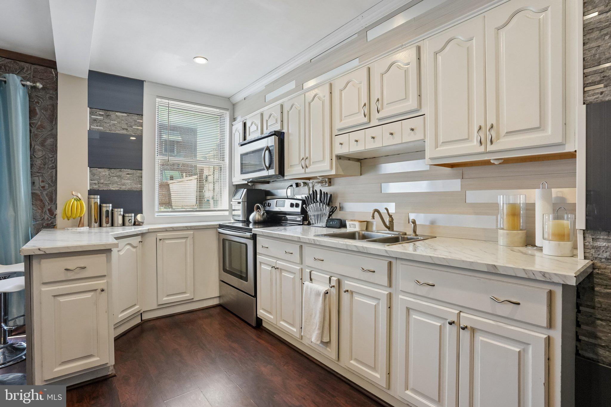 7242 Algard Street Philadelphia, PA 19135 - Photo 11 of 25 Modern kitchen with stylish accents.