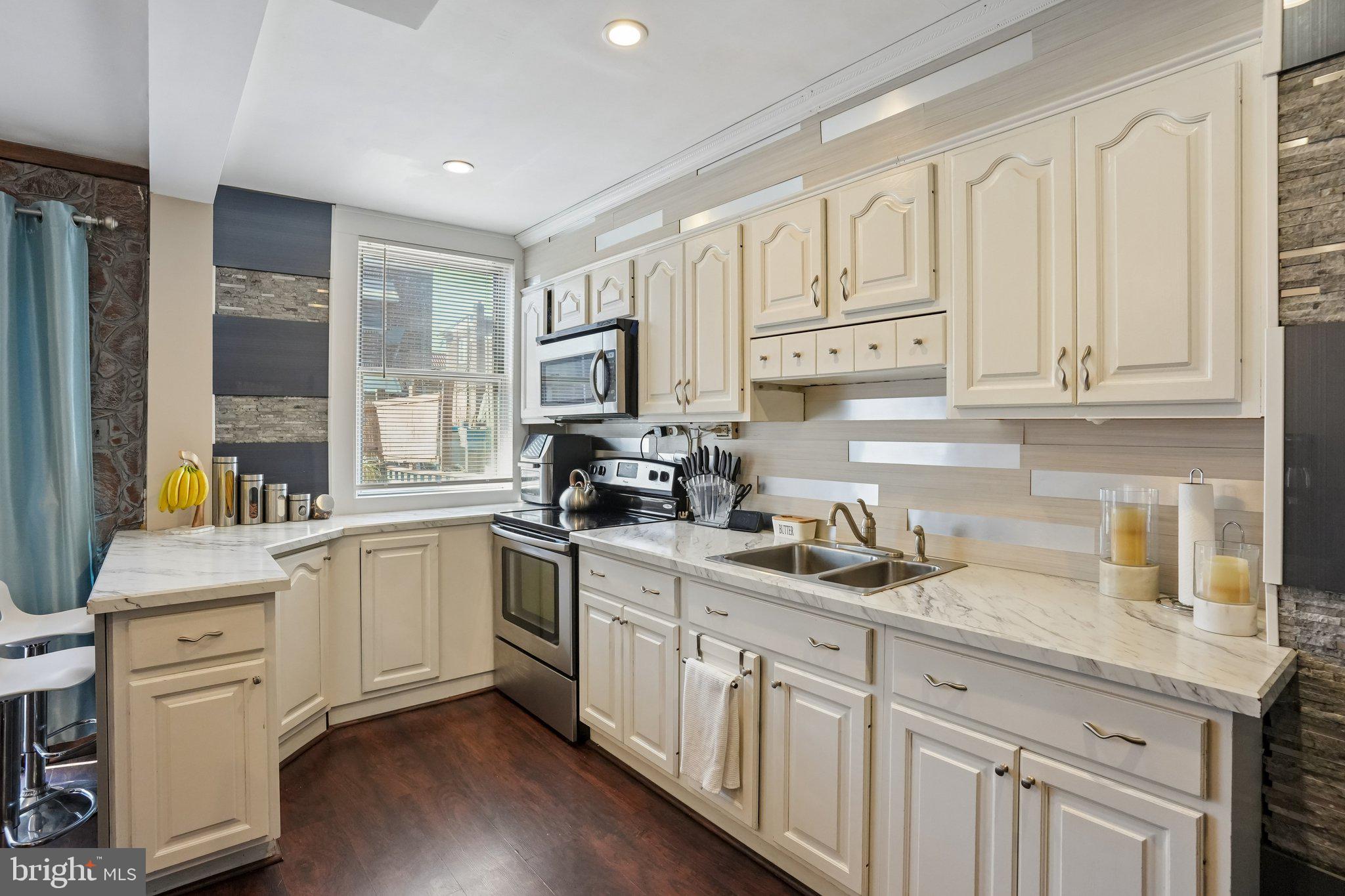 7242 Algard Street Philadelphia, PA 19135 - Photo 12 of 25 Charming kitchen with modern flair.