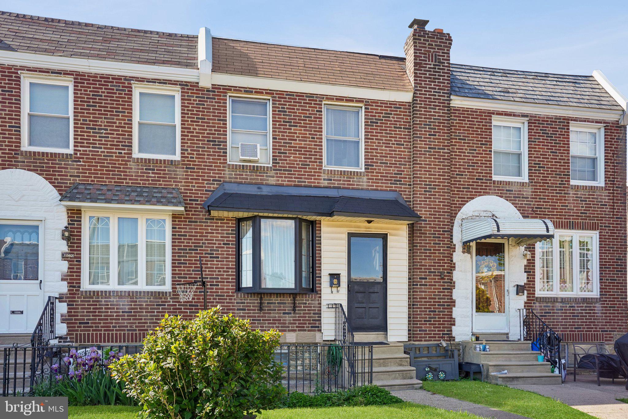 7242 Algard Street Philadelphia, PA 19135 - Photo 2 of 25 Charming brick townhome facade.