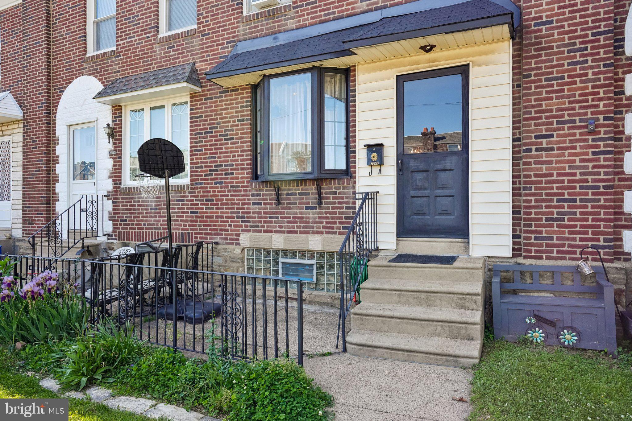 7242 Algard Street Philadelphia, PA 19135 - Photo 3 of 25 Charming brick facade with inviting steps.