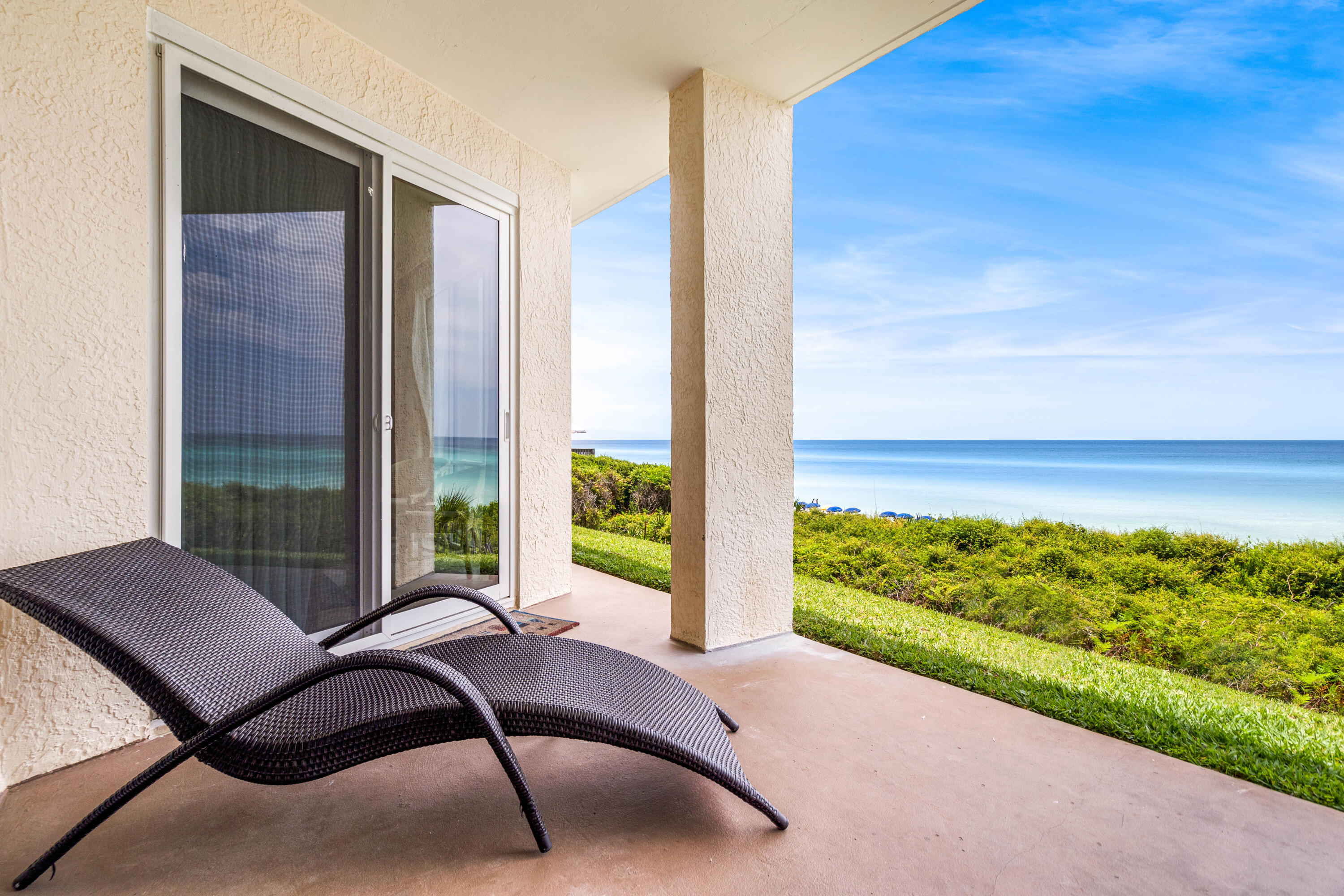 10254 East Co Highway, Unit 12W Inlet Beach, FL 32461 - Photo 21 of 42 a view of a balcony with chair and table