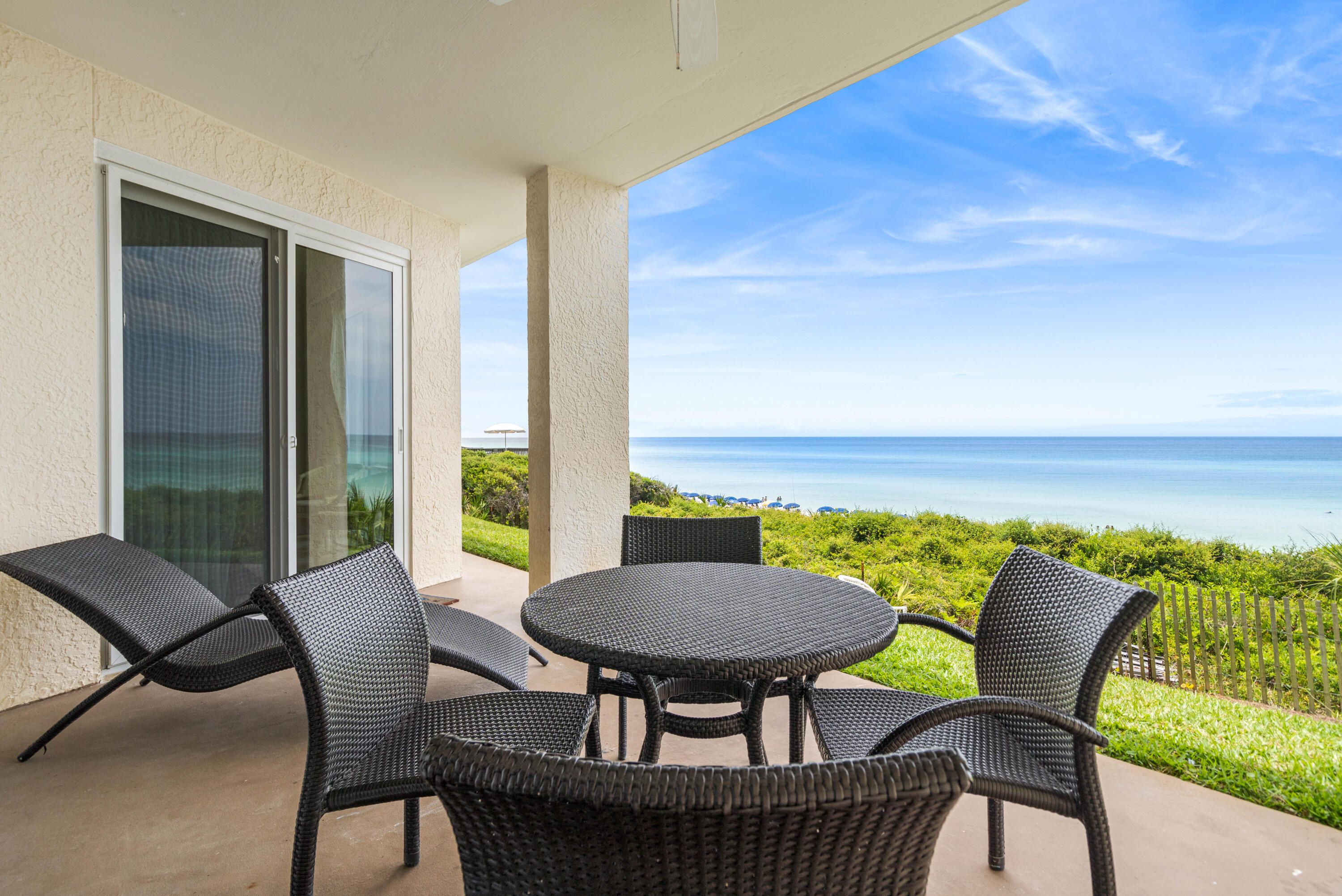 10254 East Co Highway, Unit 12W Inlet Beach, FL 32461 - Photo 24 of 42 a view of a patio with furniture and a yard
