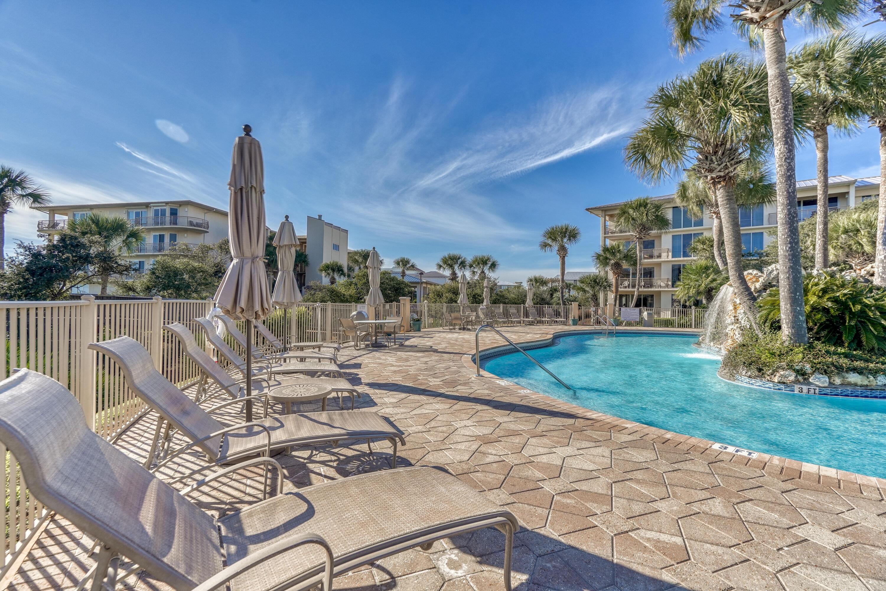 10254 East Co Highway, Unit 12W Inlet Beach, FL 32461 - Photo 26 of 42 a view of a patio with a table chairs and a patio