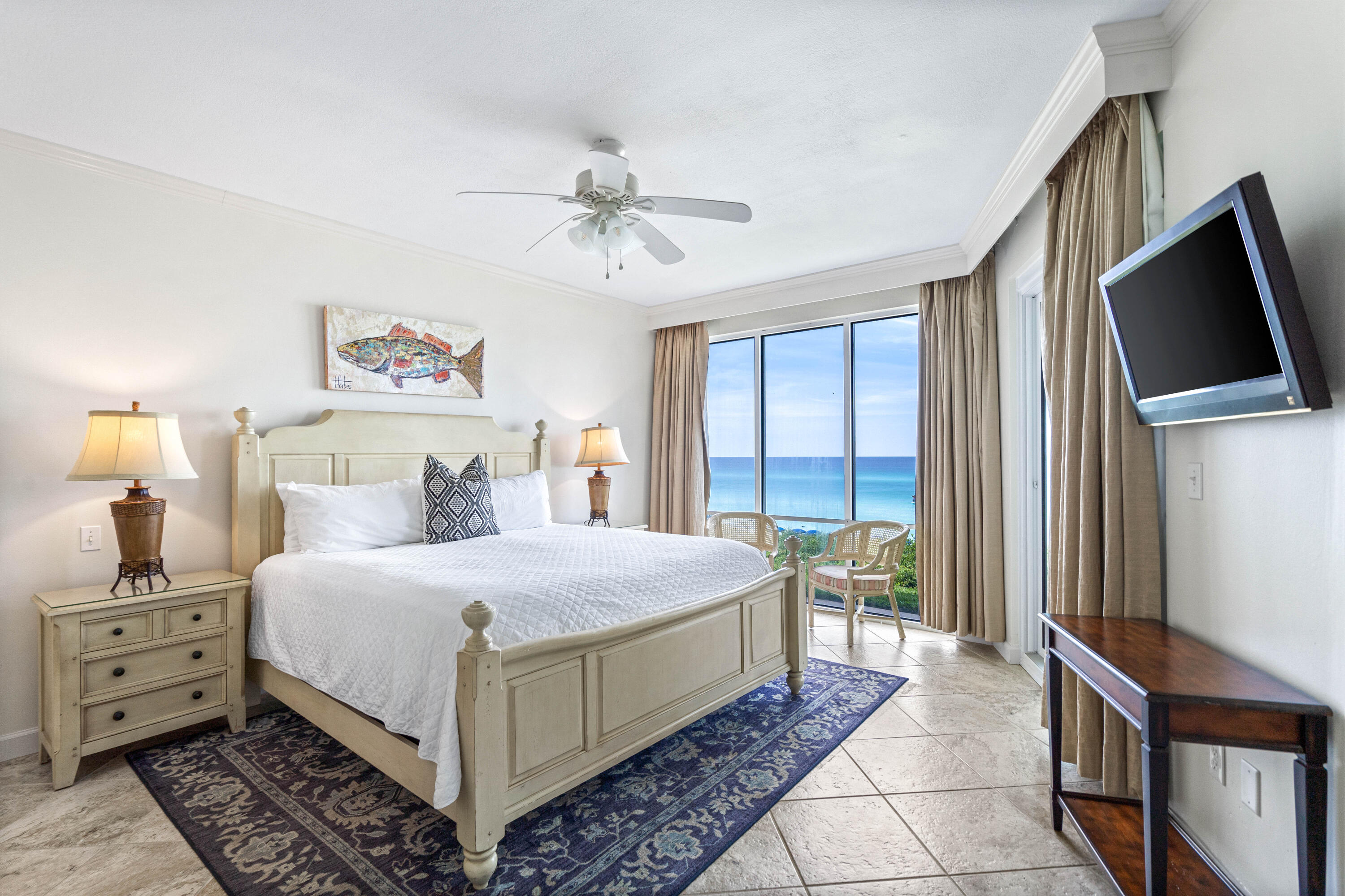 10254 East Co Highway, Unit 12W Inlet Beach, FL 32461 - Photo 3 of 42 a bedroom with a large bed and a flat tv screen on dresser