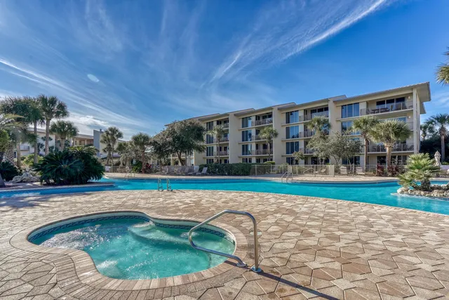 a view of a backyard with swimming pool
