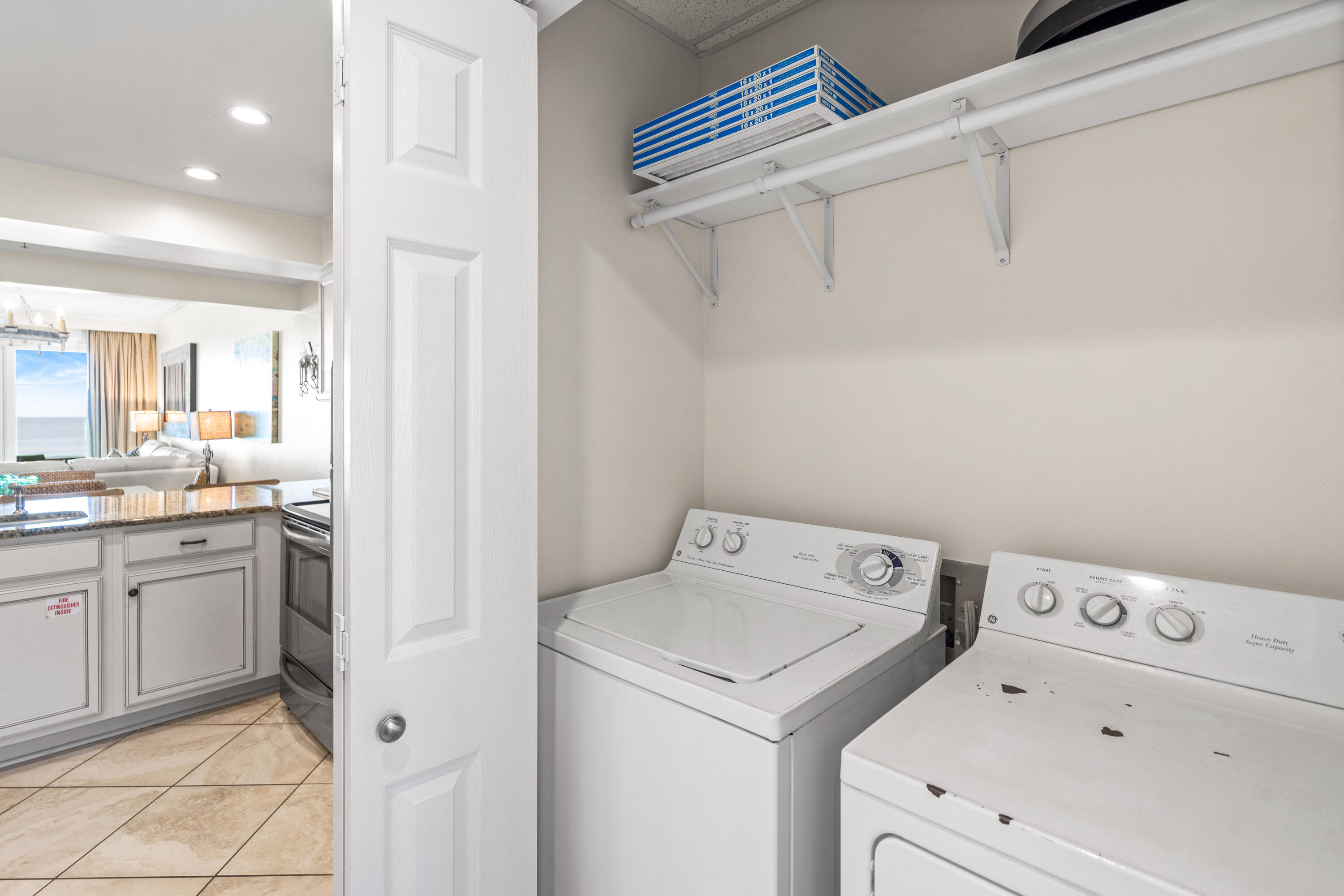10254 East Co Highway, Unit 12W Inlet Beach, FL 32461 - Photo 42 of 42 a view of washer and dryer with kitchen in the background
