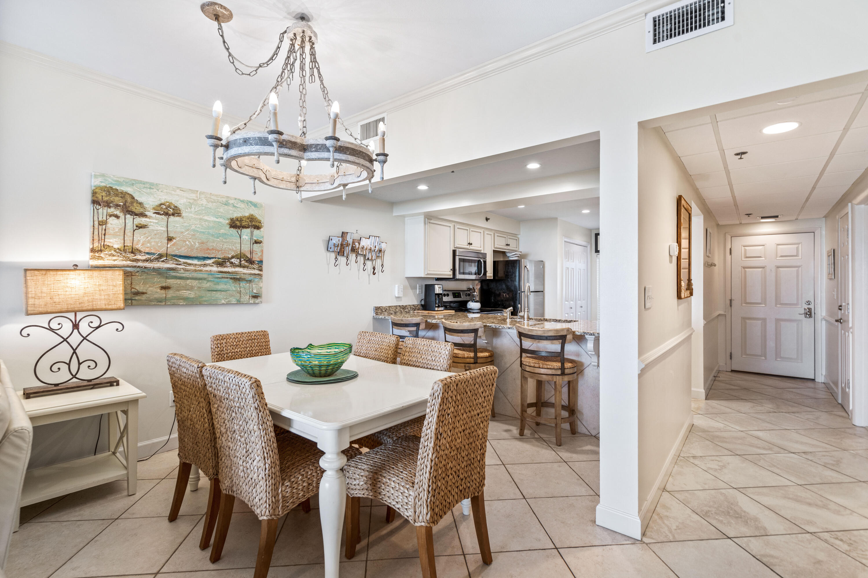 10254 East Co Highway, Unit 12W Inlet Beach, FL 32461 - Photo 7 of 42 a view of a dining room with furniture and chandelier