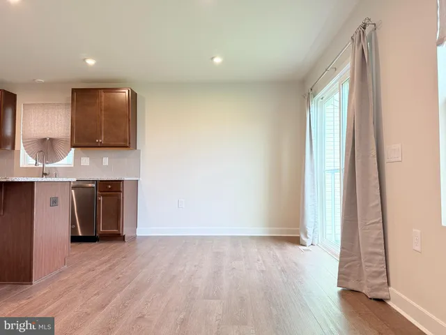 a view of a kitchen with a sink and a window
