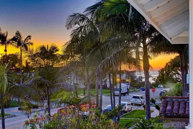 a view of a porch with furniture and backyard