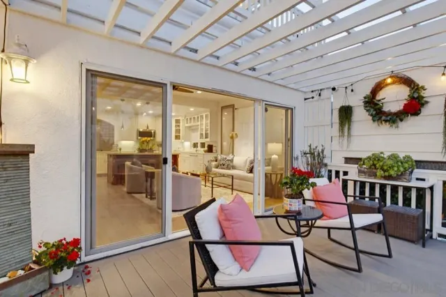 a living room with furniture and a painting on the wall