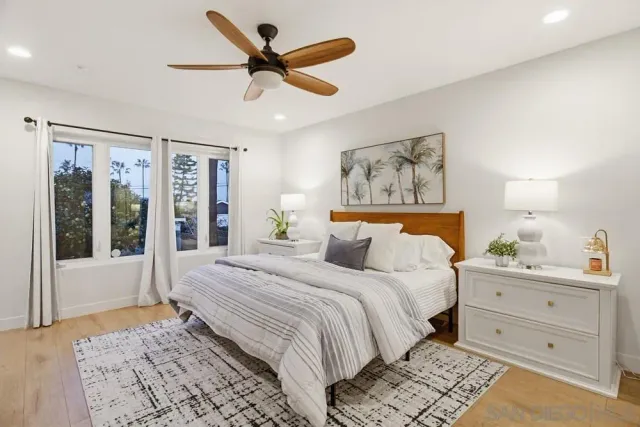 a bedroom with a large bed and a window