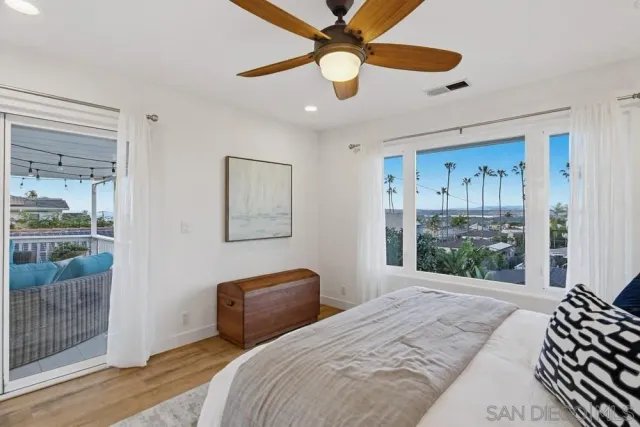 a view of a house with backyard sitting area and garden