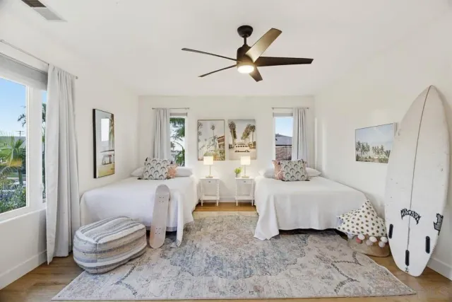a view of a swimming pool with a table and chairs under an umbrella