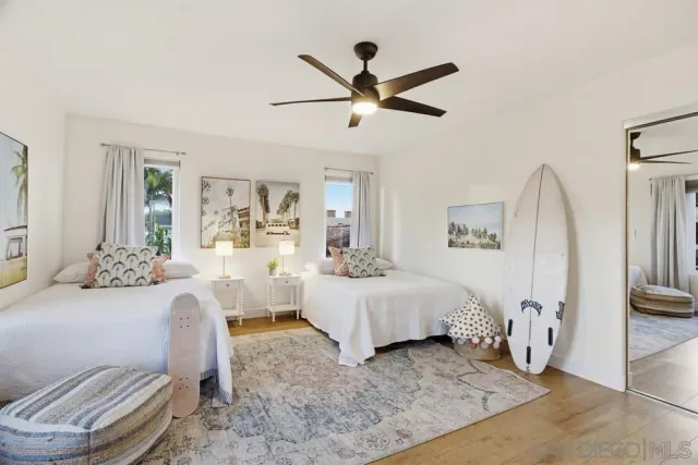 a front view of a house with a garden and fountain