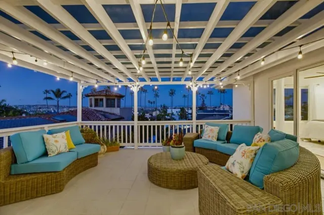 a view of a house with backyard sitting area and garden