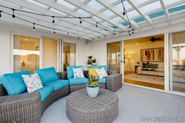 a view of a chairs and table in the patio