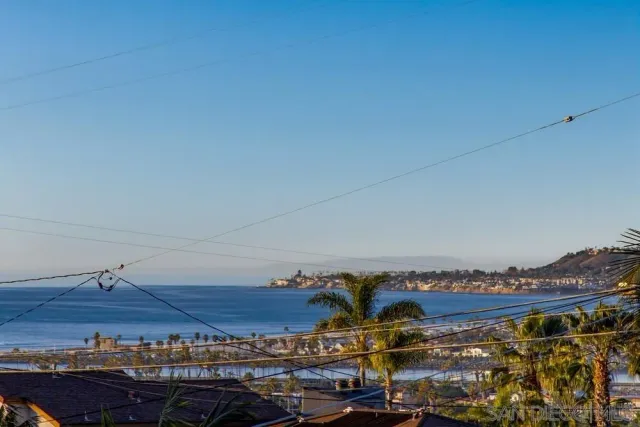 a view of a livingroom with furniture and staircase