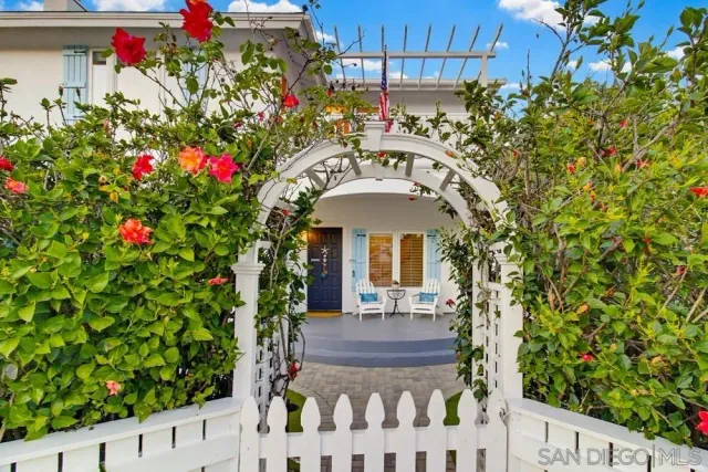 a living room with furniture a fireplace and windows