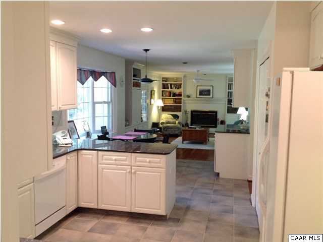 2803 Huntington Road Charlottesville, VA 22901 - Photo 15 of 42 a kitchen with white cabinets and a refrigerator