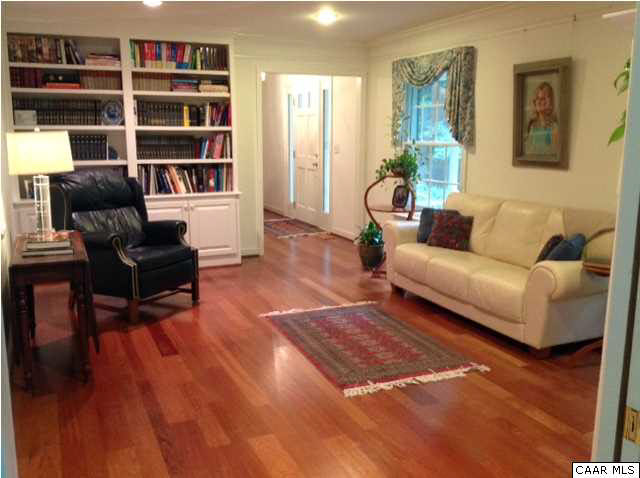 2803 Huntington Road Charlottesville, VA 22901 - Photo 2 of 42 a living room with furniture and a book shelf