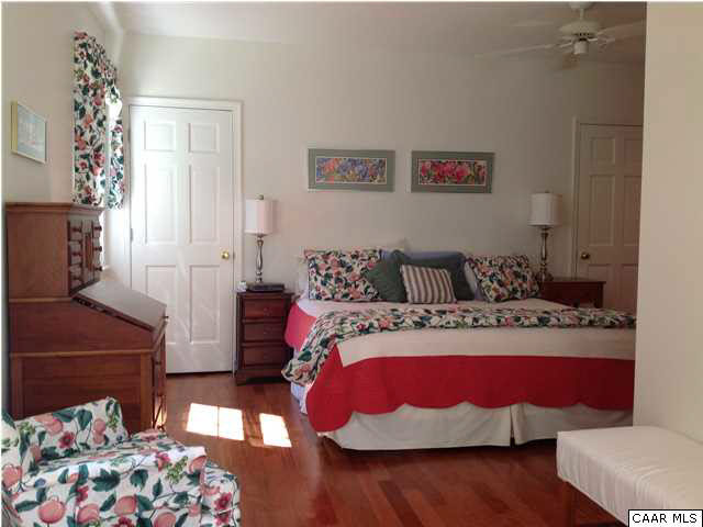 2803 Huntington Road Charlottesville, VA 22901 - Photo 30 of 42 a bedroom with a bed and wooden floor