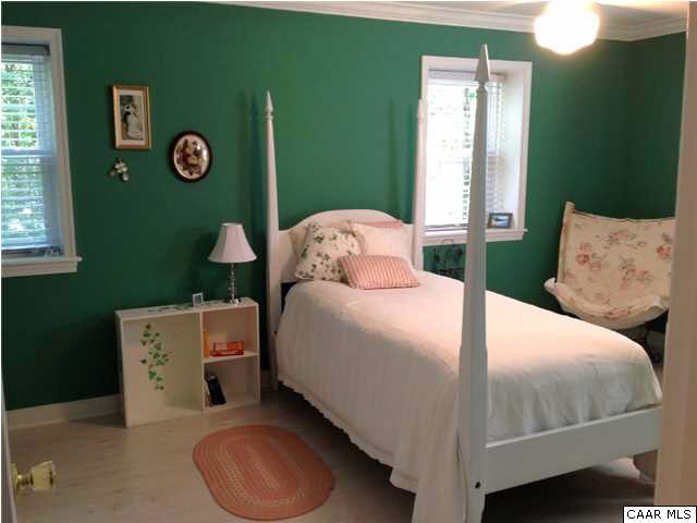 2803 Huntington Road Charlottesville, VA 22901 - Photo 38 of 42 a bedroom with a bed and a lamp