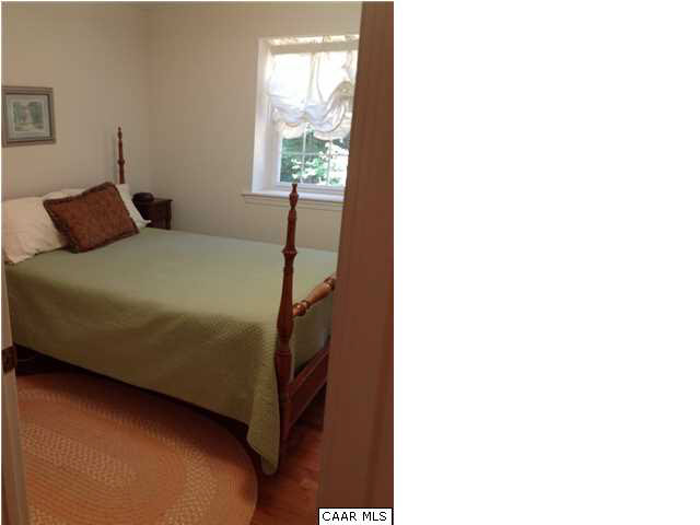 2803 Huntington Road Charlottesville, VA 22901 - Photo 40 of 42 a bed sitting in a bedroom next to a window