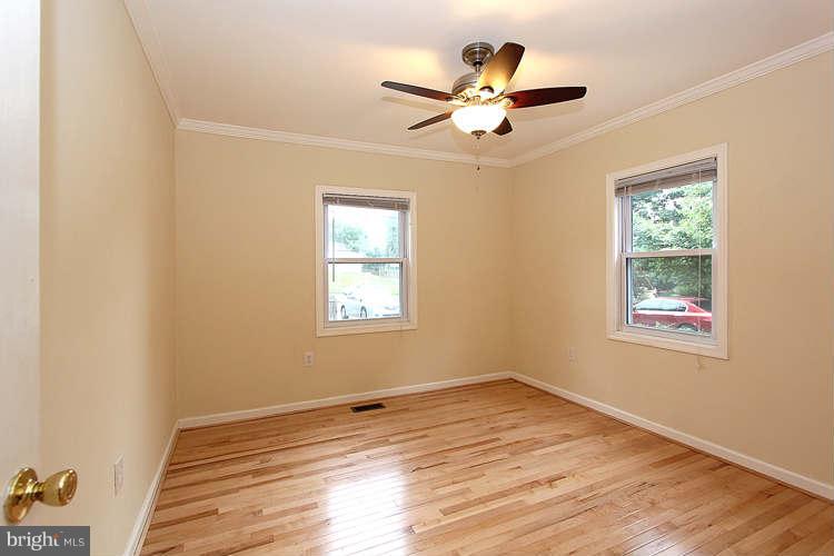 4403 Randolph Road Silver Spring, MD 20906 - Photo 14 of 28 an empty room with wooden floor fan and windows