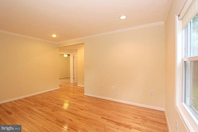 4403 Randolph Road Silver Spring, MD 20906 - Photo 5 of 28 a view of empty room with wooden floor and fan
