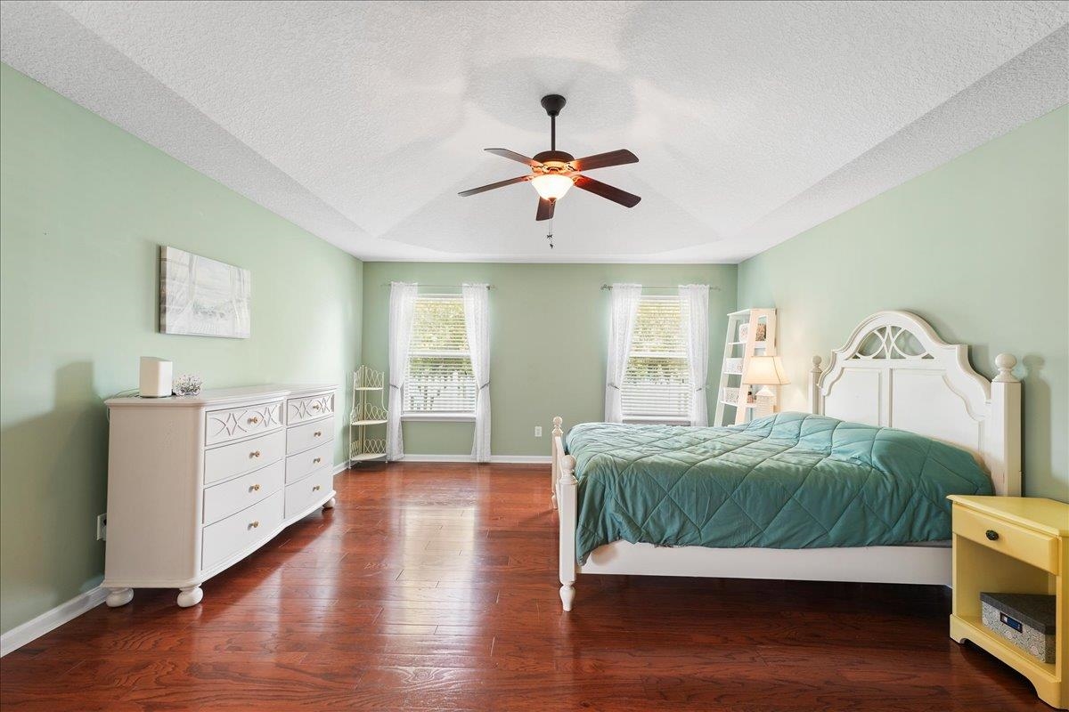 880 East Red House Branch Road St. Augustine, FL 32084 - Photo 17 of 65 a bedroom with a bed and a dresser