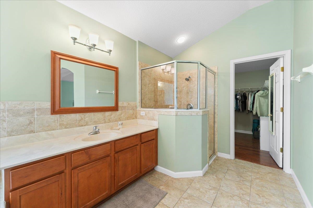 880 East Red House Branch Road St. Augustine, FL 32084 - Photo 22 of 65 a bathroom with a double vanity sink mirror and